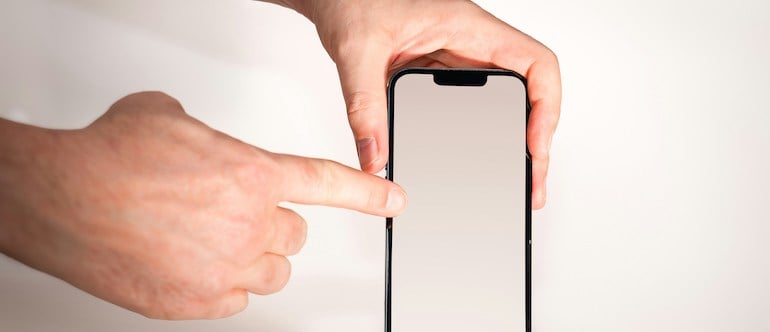 smartphone screen pointing finger