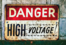 Sign reads, “Danger: High Voltage!”