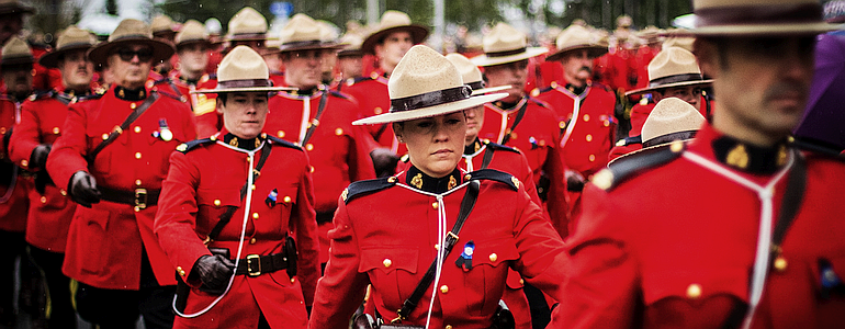 Canadian “mounties” marching down the street